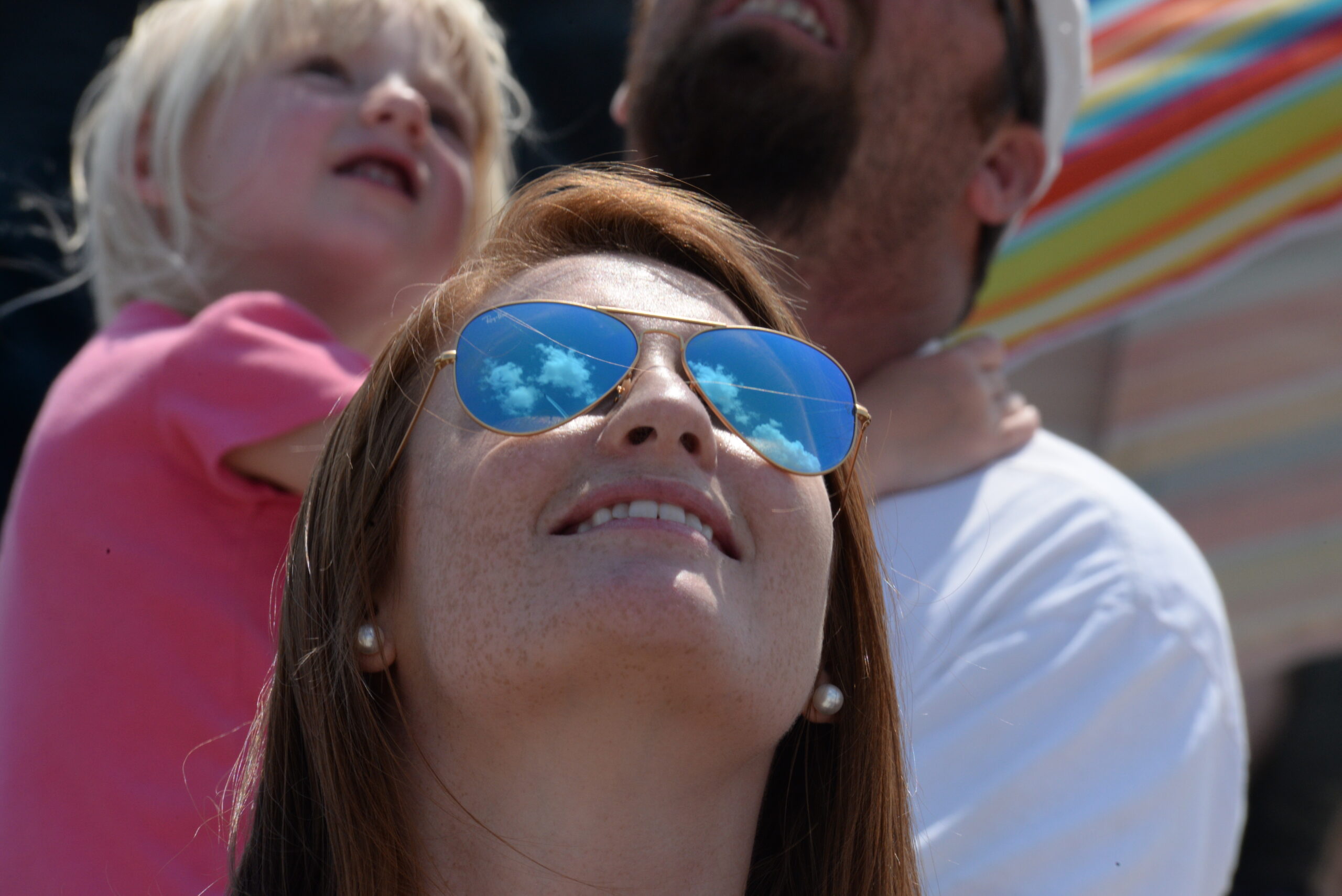 A spectator enjoys the high flying performance of the Blue Angels during the 2015 Defenders of Liberty Airshow on Barksdale Air Force Base, Louisiana, May 3. The mission of the Blue Angels is to showcase the pride and professionalism of the United States Navy and Marine Corps by inspiring a culture of excellence and service to country through flight demonstrations and community outreach. (U.S. Air Force photo/Airman 1st Class Luke Hill)