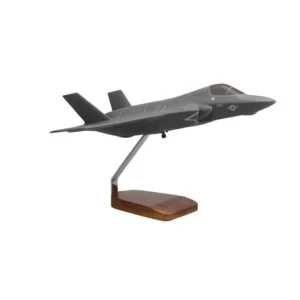Hand-carved mahogany model of the Lockheed Martin F-35B STOVL fighter jet on wooden display stand