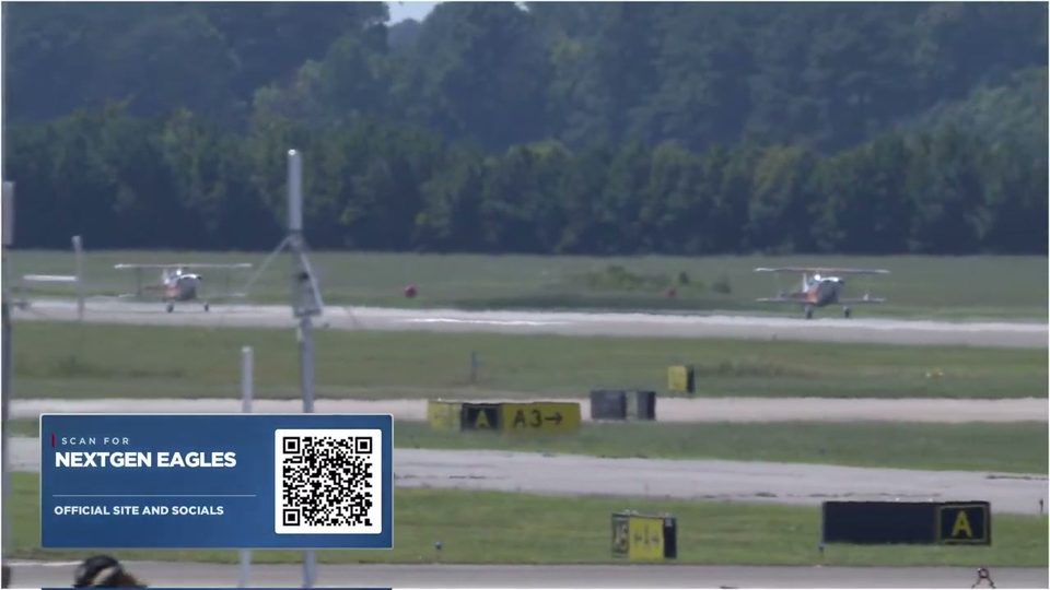 On-air QR code card over the runway